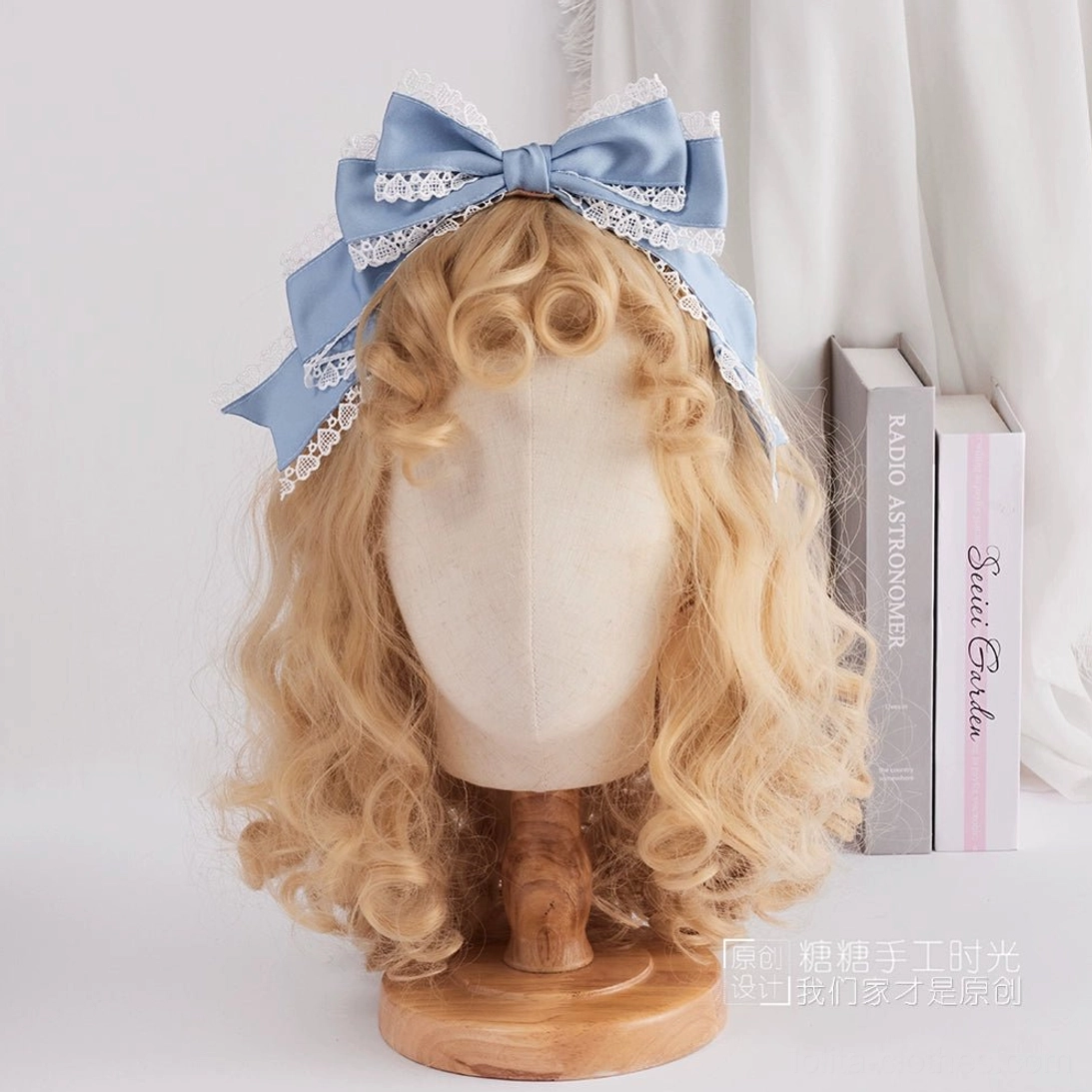 Light blue satin sweet lolita oversized bow with white scalloped lace trims on edges front view headband display