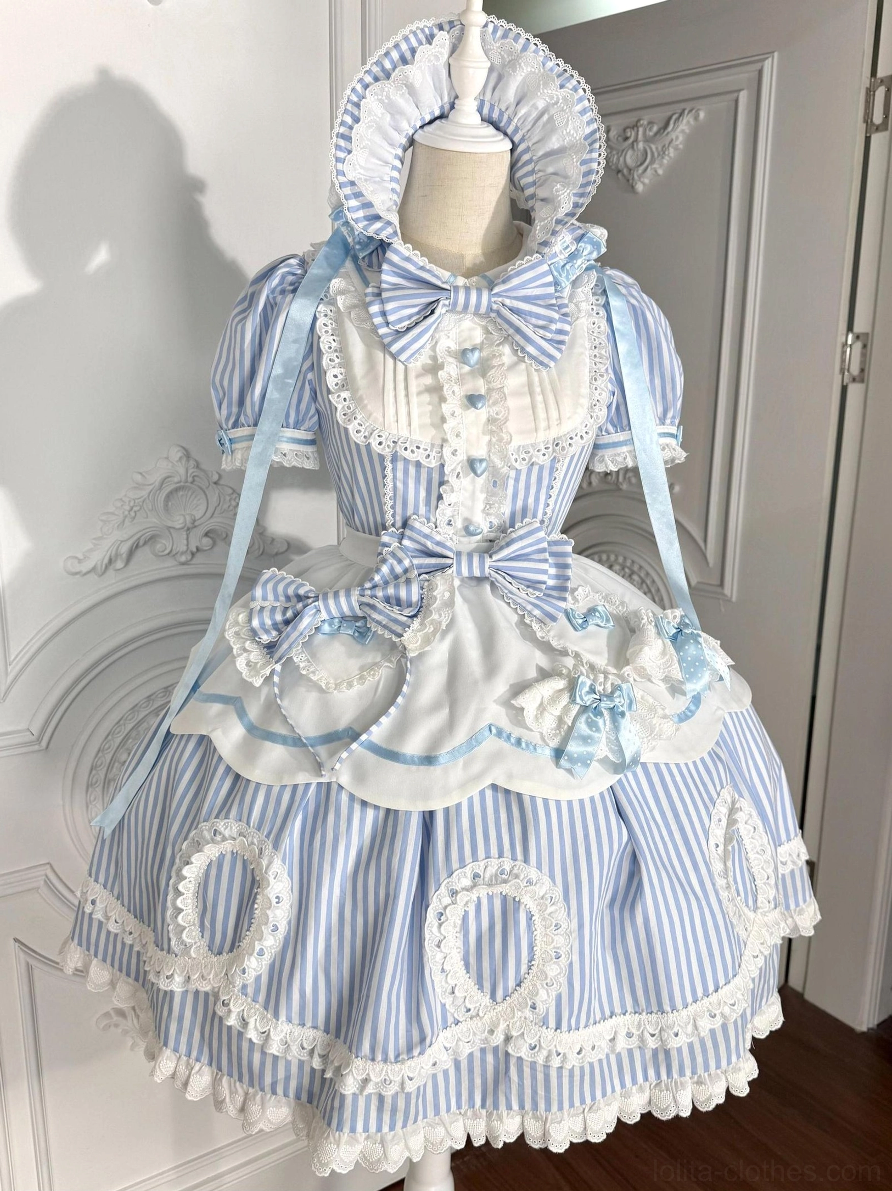 Light blue vertical striped old school lolita OP dress with detachable apron and matching bonnet displayed on dress form front view
