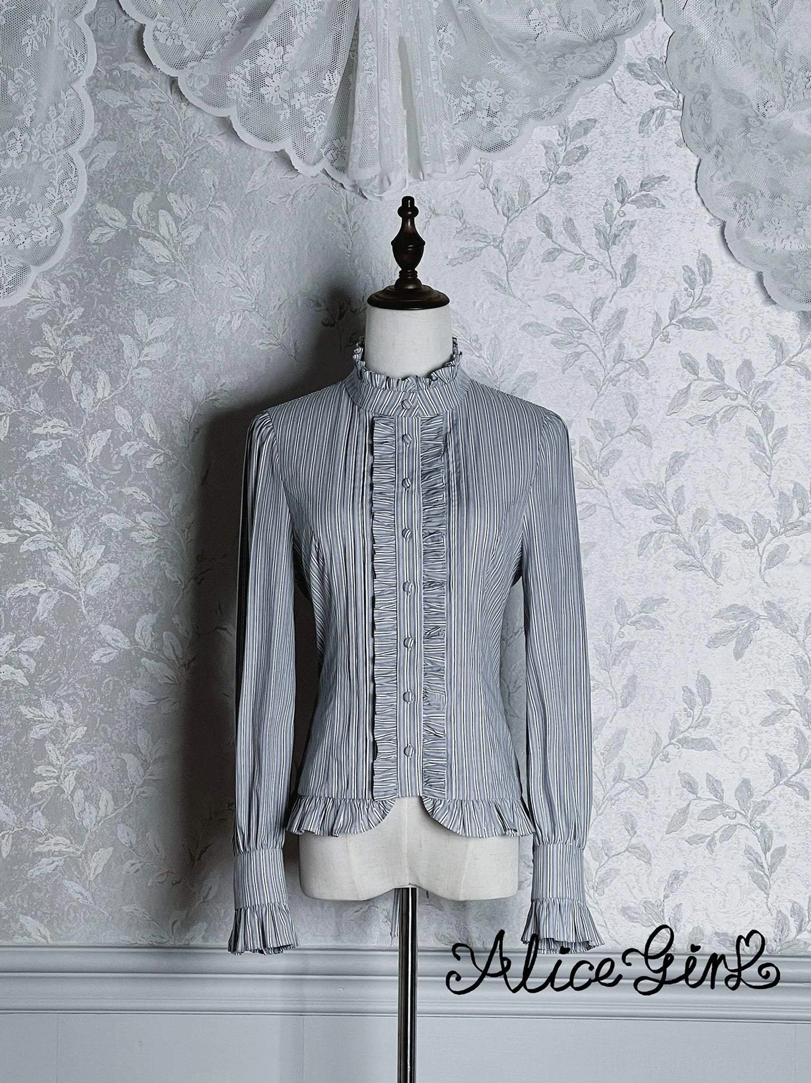 Light blue striped slim-fit lolita blouse front mannequin view with ruffled collar and buttoned closure