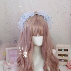 Pastel light blue lolita bow hair clip with ruffled organza and star metal ornaments close-up front detail view