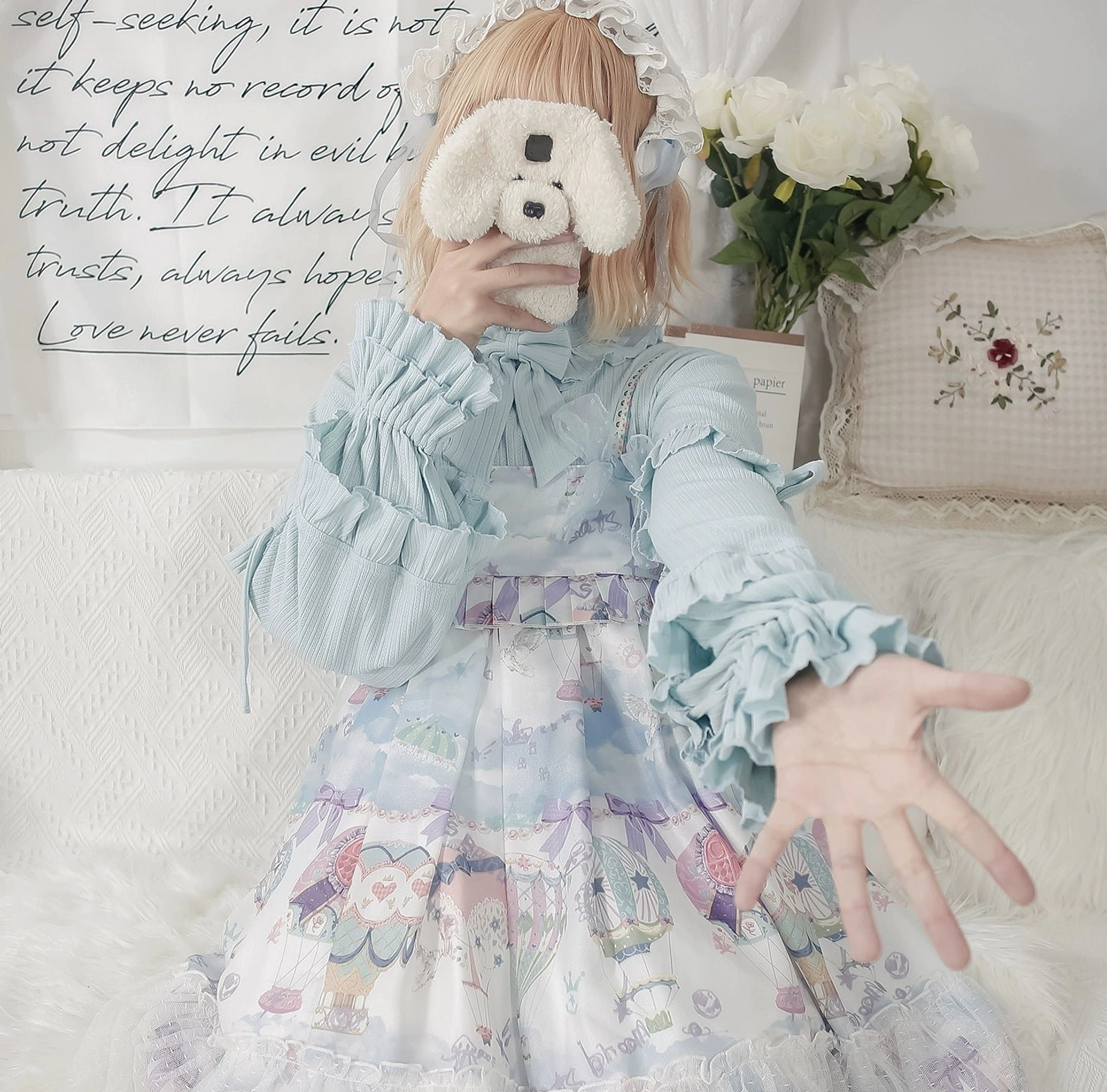Light blue sweet lolita inner blouse with puff sleeves worn with printed fairy tale JSK dress model styling coordinate