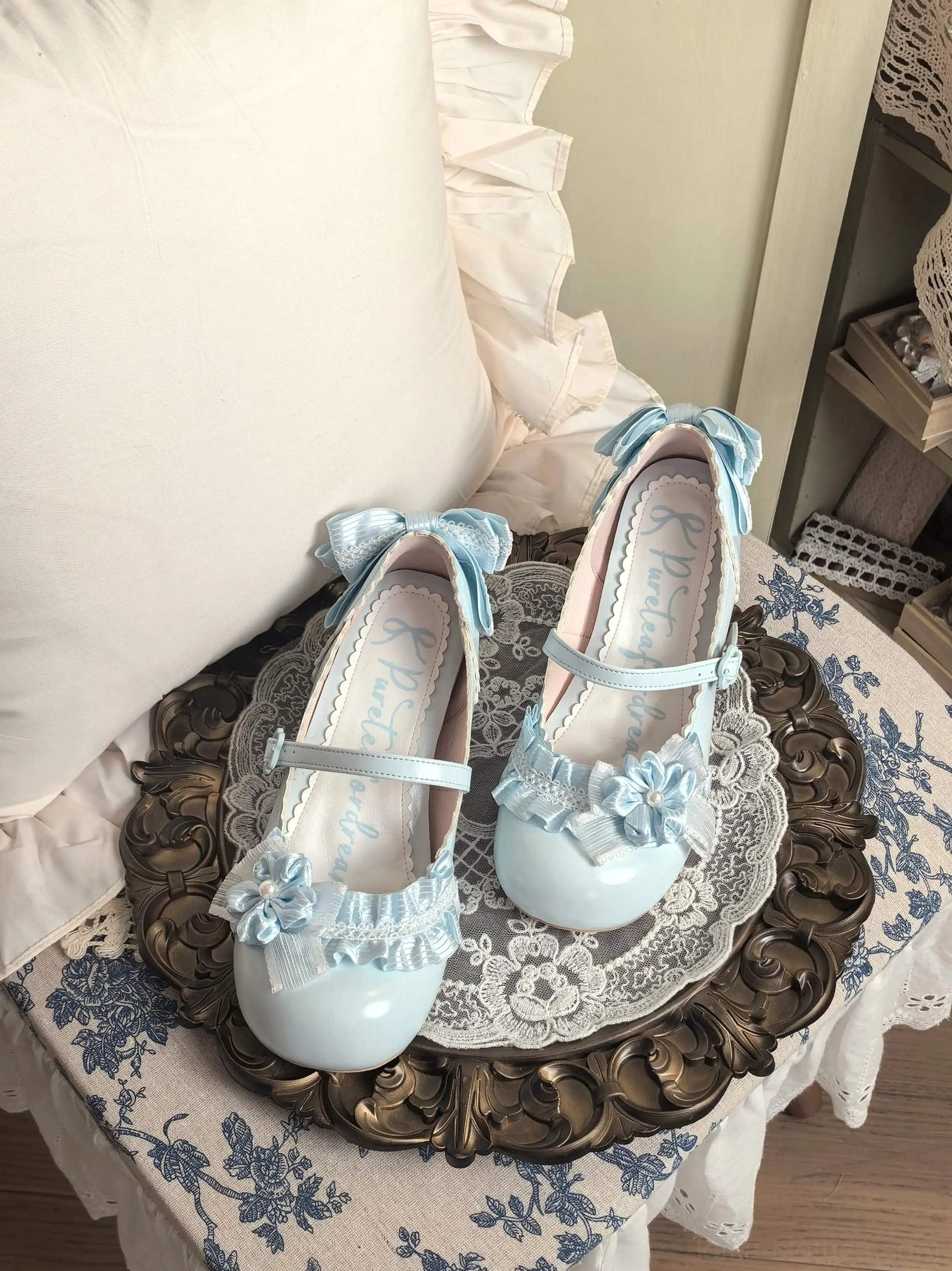 light blue sweet lolita mary jane heel shoes close up top view satin bow ankle strap floral ruffled toe decoration branded insole