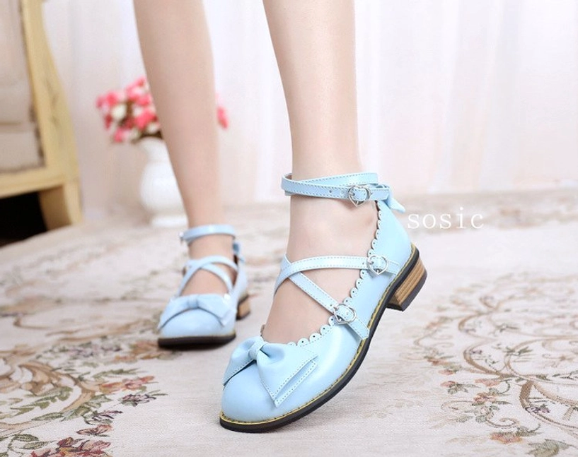 Light blue sweet Lolita low heel Mary Jane shoes with heart shaped buckle cross straps front bow ornament worn on model