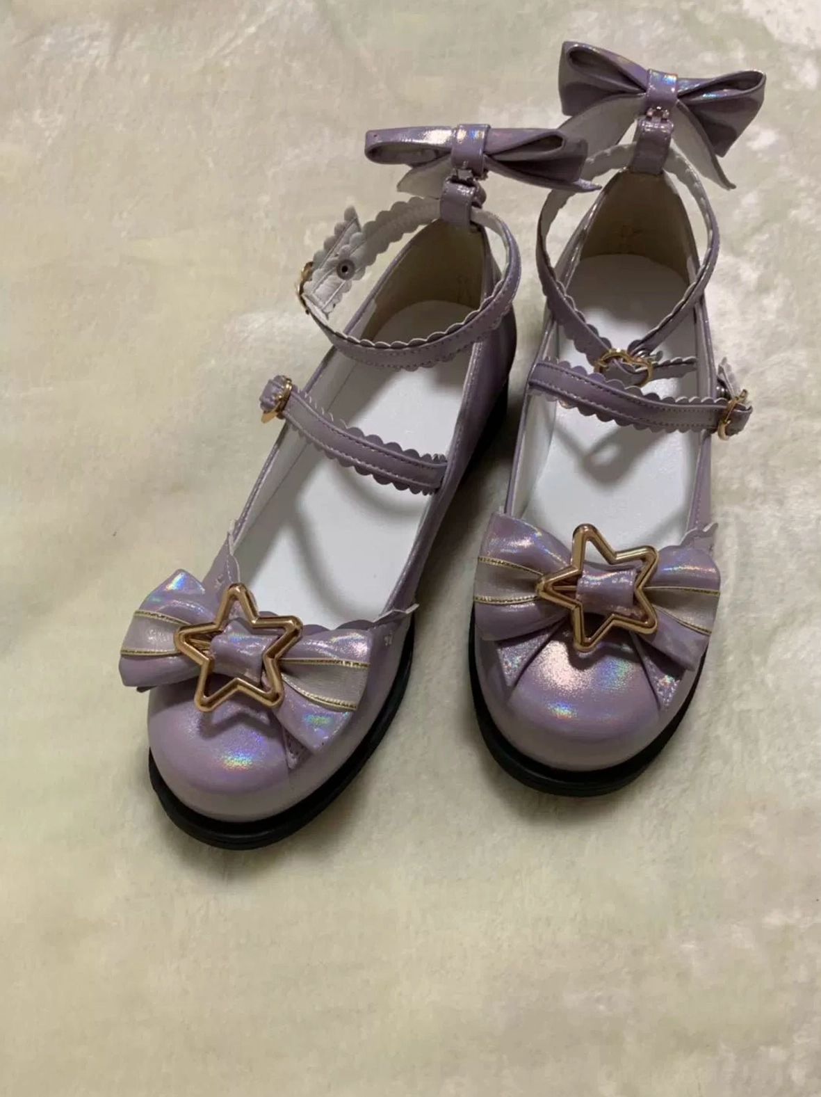 Light blue sweet lolita mary jane shoes with sun-reactive glitter effect front bow accent heel bow detail star-shaped ornaments and double ruffled ankle straps