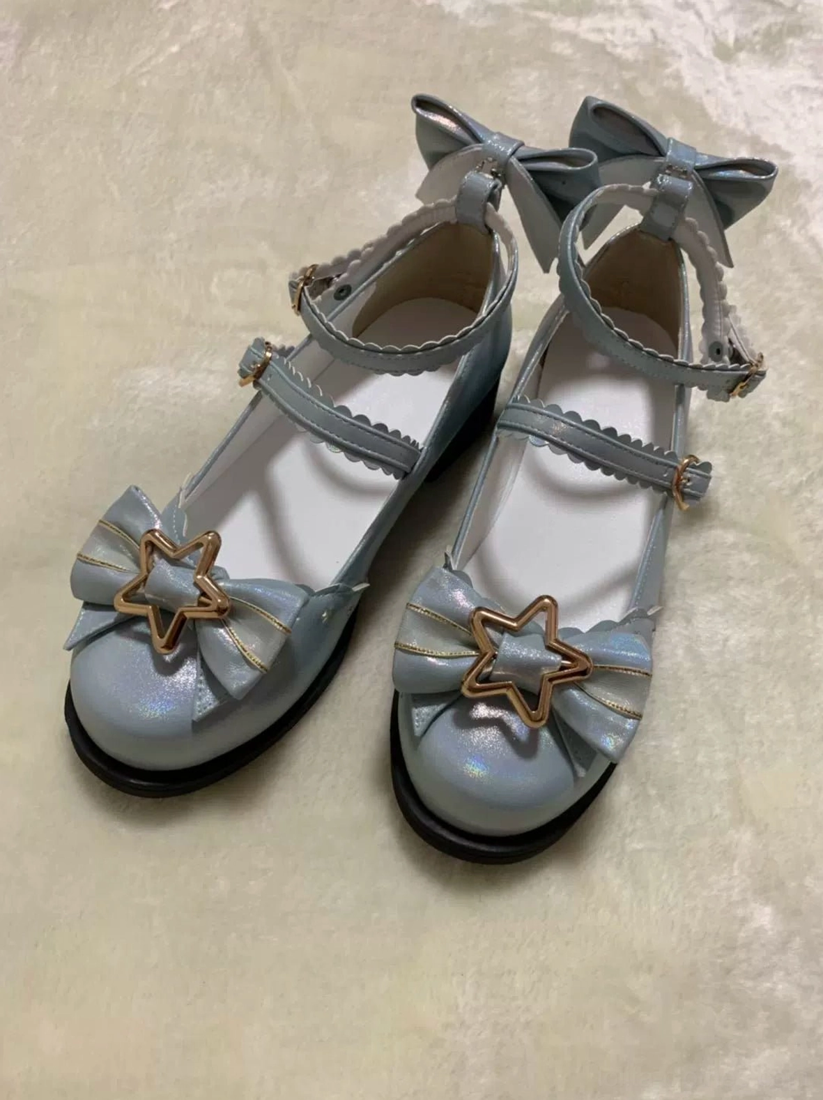 Light blue sweet lolita shoes with glitter effect under sunlight star-shaped gold hardware double ankle straps low block heel and premium PU leather construction