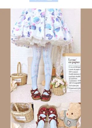 Light blue 120D velvet lolita tights with white bow and cross print patterns styled on model wearing seashell print skirt in indoor studio setting