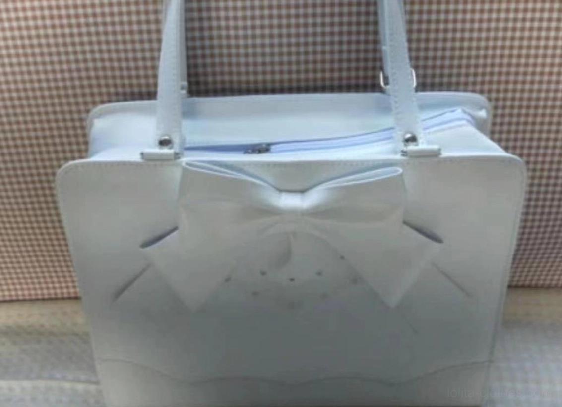 Light gray Lolita PU tote handbag showing structured side profile, top closure, and front bow lace detail