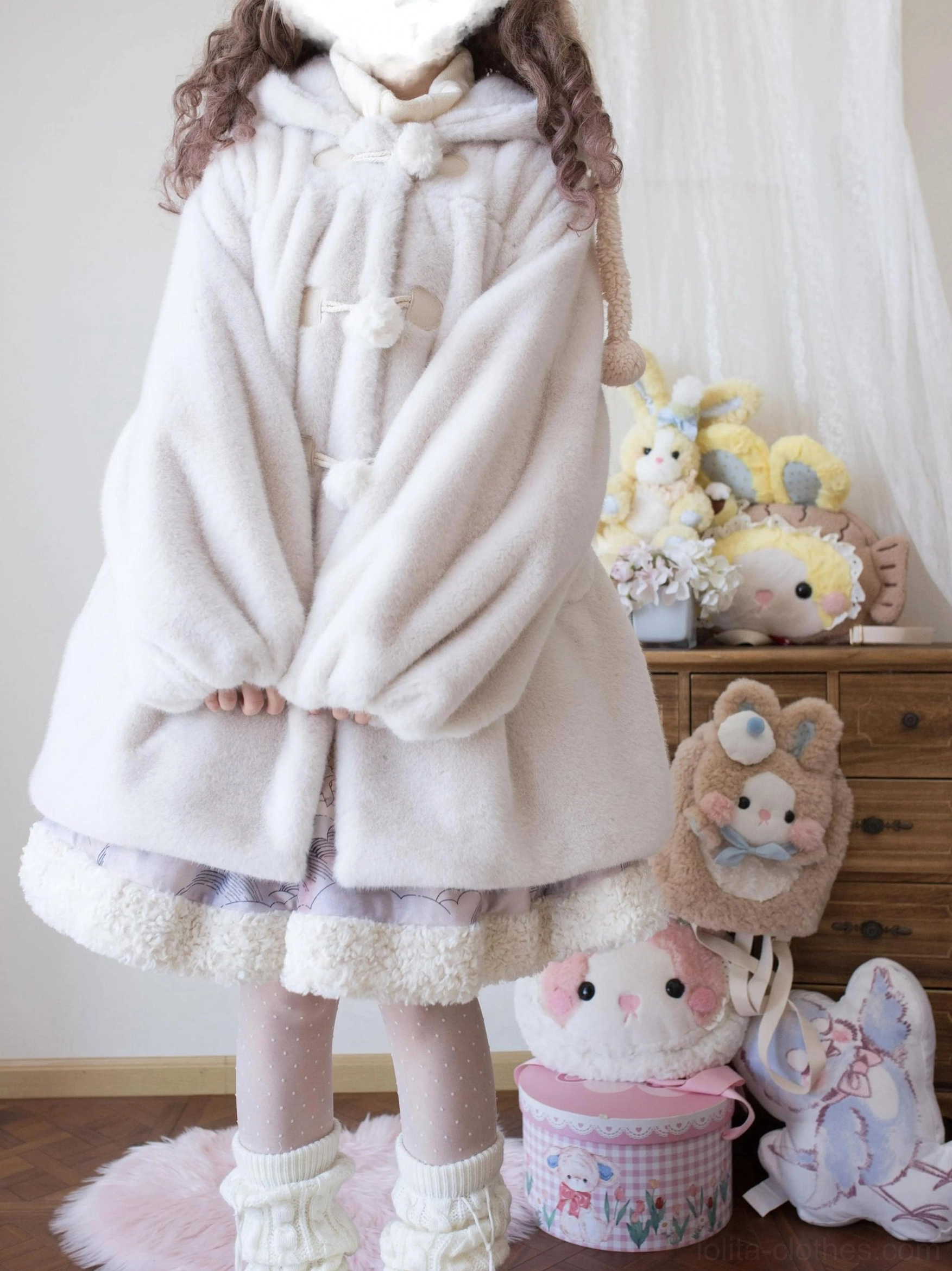 Light gray off-white lolita winter thickened fluffy overcoat with smooth fleece texture, pom-pom buttons and ruffled bottom hem, front view