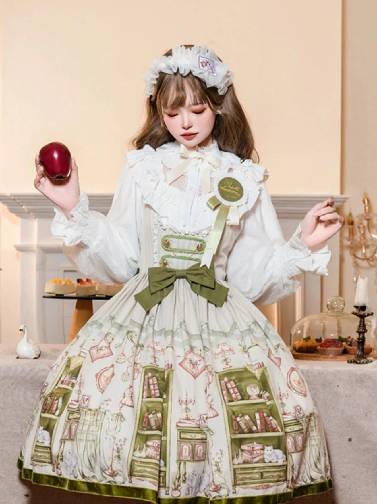 Light green bust-support Lolita JSK dress featuring bookstore print design, shown on mannequin with full front view and structured silhouette