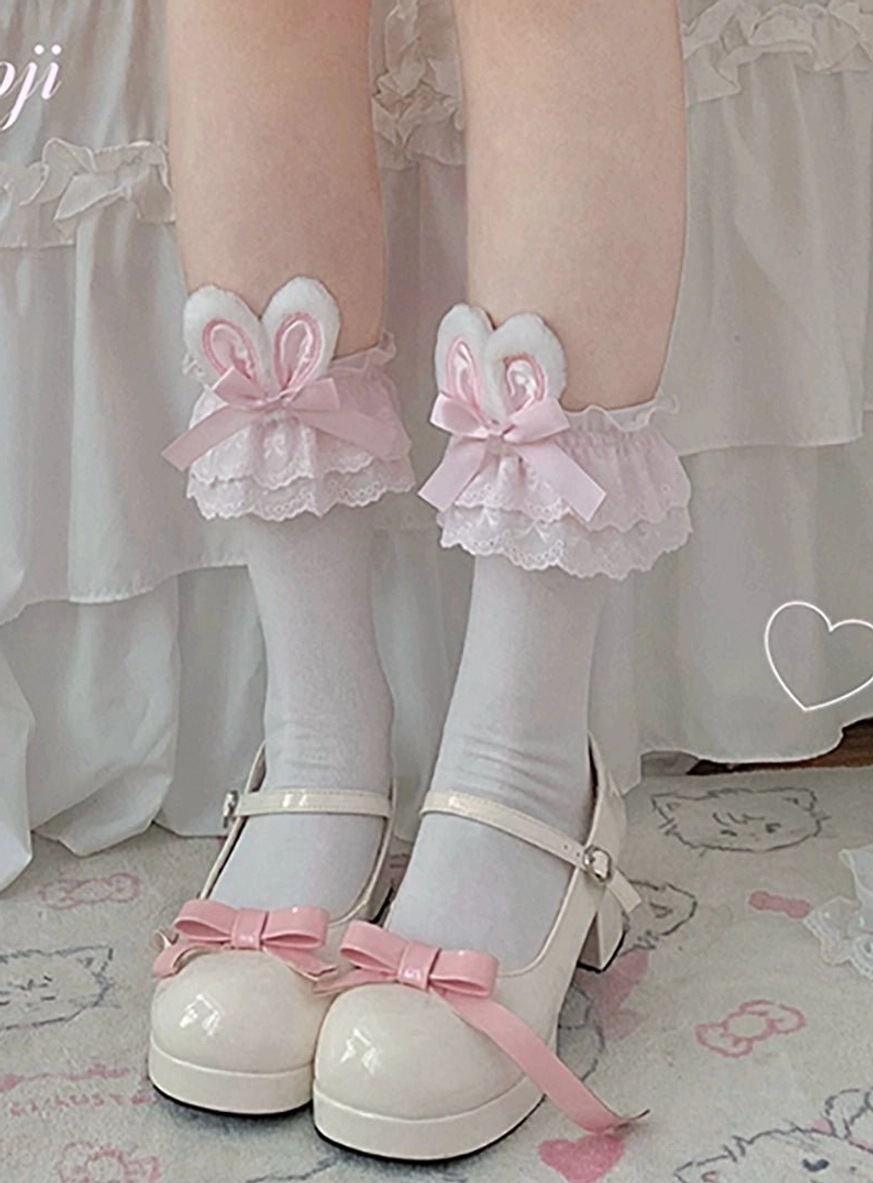 Light pink bunny ear lolita socks front close-up view matching pink bow Mary Jane shoes light pink plush bunny ear decoration pastel background