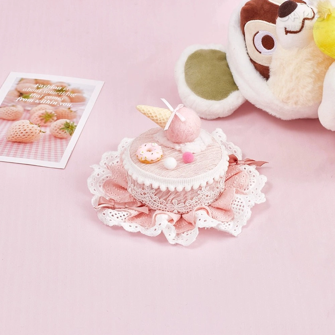 Light pink Lolita cake hair clip top view with lace frill trim ice cream cone mini donut and pom-pom decorations
