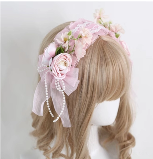 Light pink elegant lolita floral lace headband with retaining clip on mannequin displaying artificial rose bouquets and pearl pendant details