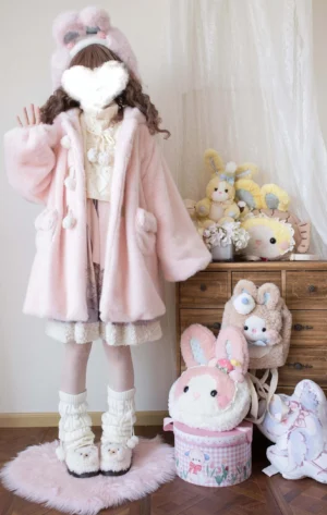 Light pink lolita winter thickened fleece overcoat with bear ear hood, pom-pom toggle buttons and ruffled hem, full-body front standing in plush studio