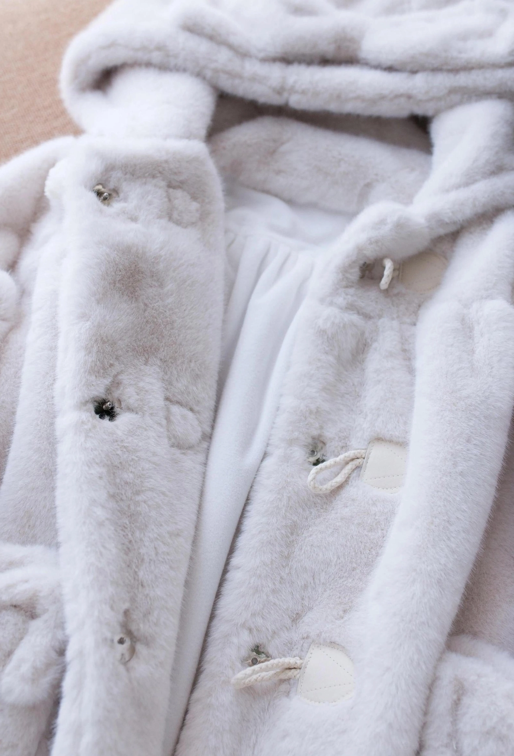 Light pink lolita winter thickened fleece overcoat coordinated with matching pastel accessories, bunny ear headbow and plush bag for complete sweet lolita look