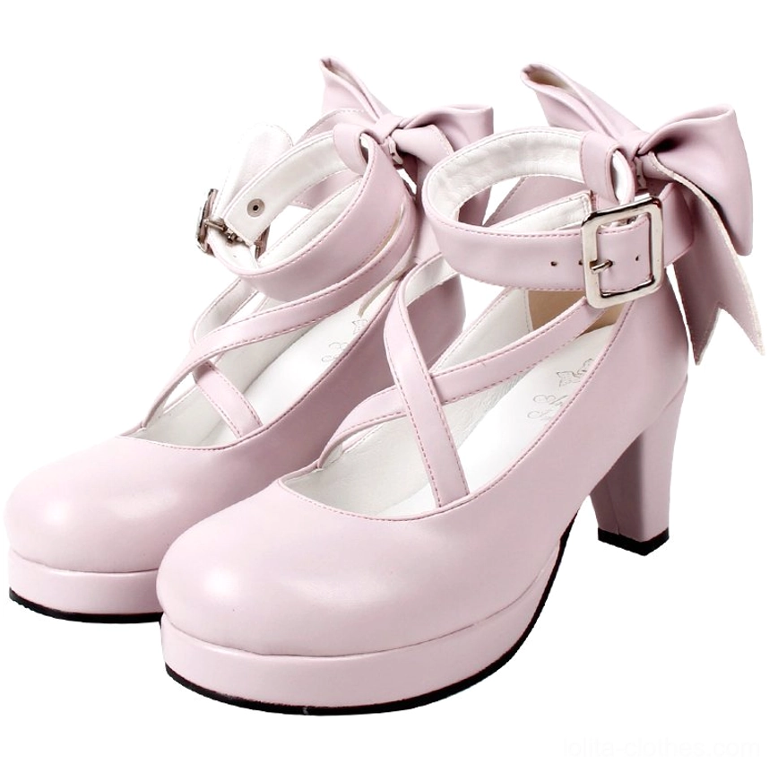 Light pink matte Lolita platform high heel shoes with soft finish, crossover ankle buckle straps, large decorative back bow, round platform toe, and block heel - front three-quarter view pair