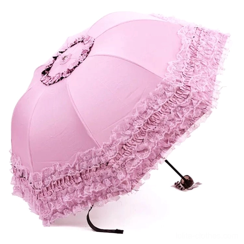 Light pink lace ruffled sun parasol in oblique side view displaying canopy top and layered frilled lace edging with central lace rosette decoration