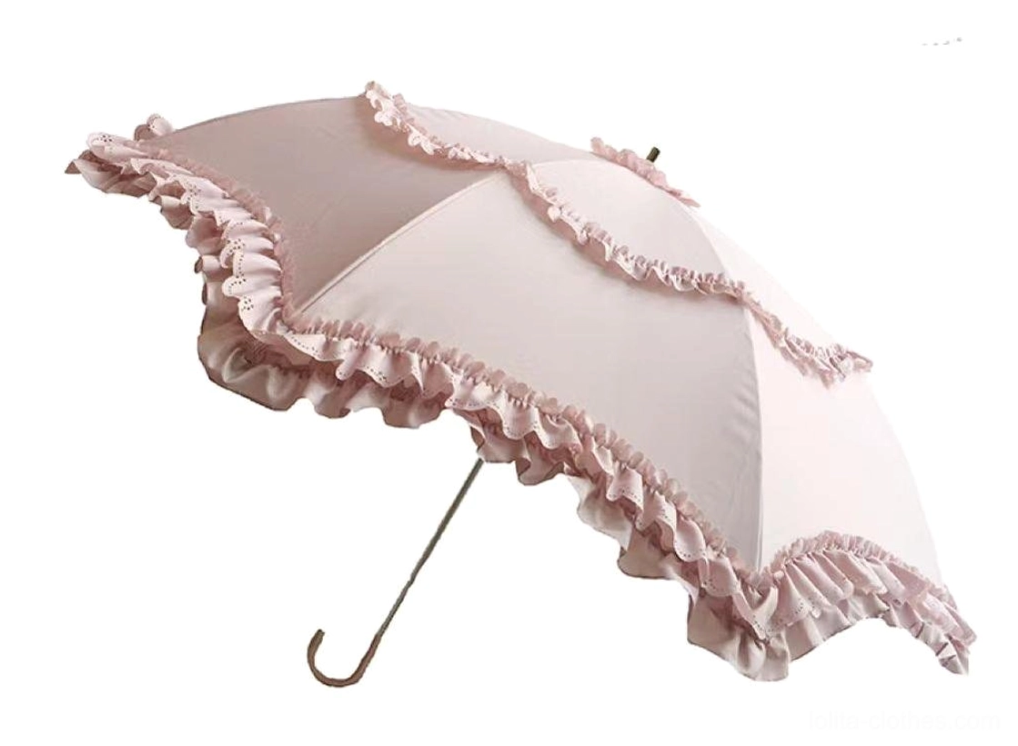 Light pink Sweet Lolita parasol with gradient canopy and scalloped ruffled lace trim featuring ivory metal handle