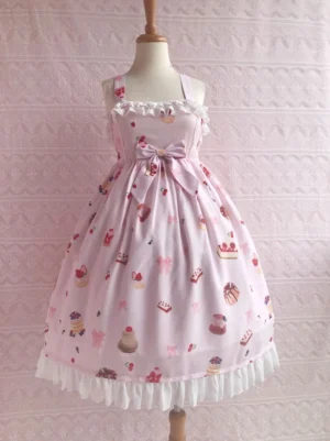 Light pink kawaii lolita dessert printed JSK jumper skirt dress with white lace ruffles on square neckline and hemline, front waist bow, and all-over cute pastry print on wooden mannequin