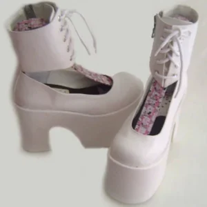 Light pink and white lolita platform Mary Jane boots with floral printed insole, front lace-up design and extra thick block platform heel, three-quarter flat view
