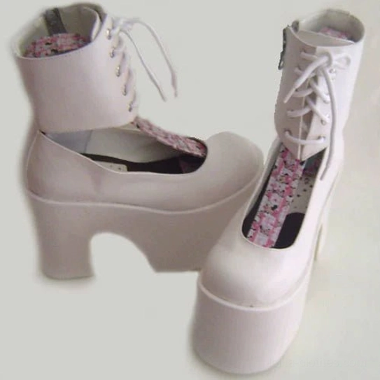 Light pink and white lolita platform Mary Jane boots with floral printed insole, front lace-up design and extra thick block platform heel, three-quarter flat view