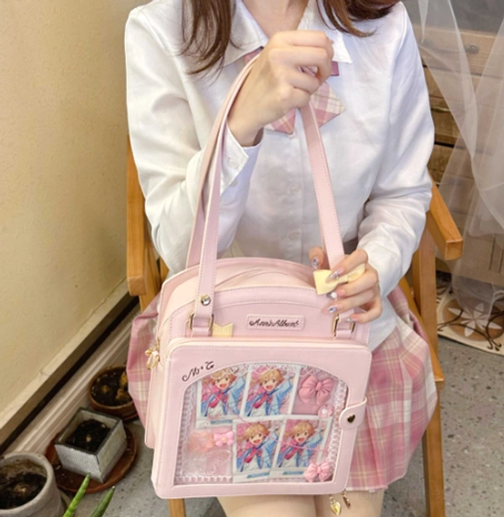 Light purple lolita checkered itabag worn shoulder carry back view outdoor with comic card display top carry strap