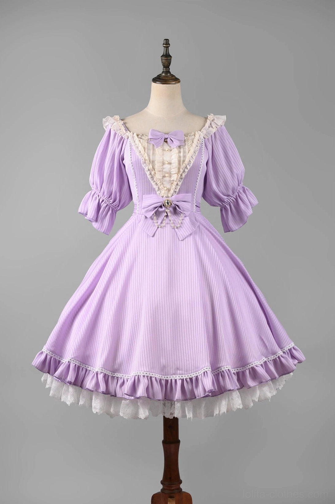 Light purple lolita OP dress detail view front bow decoration waist shaping double pleated hem construction quality