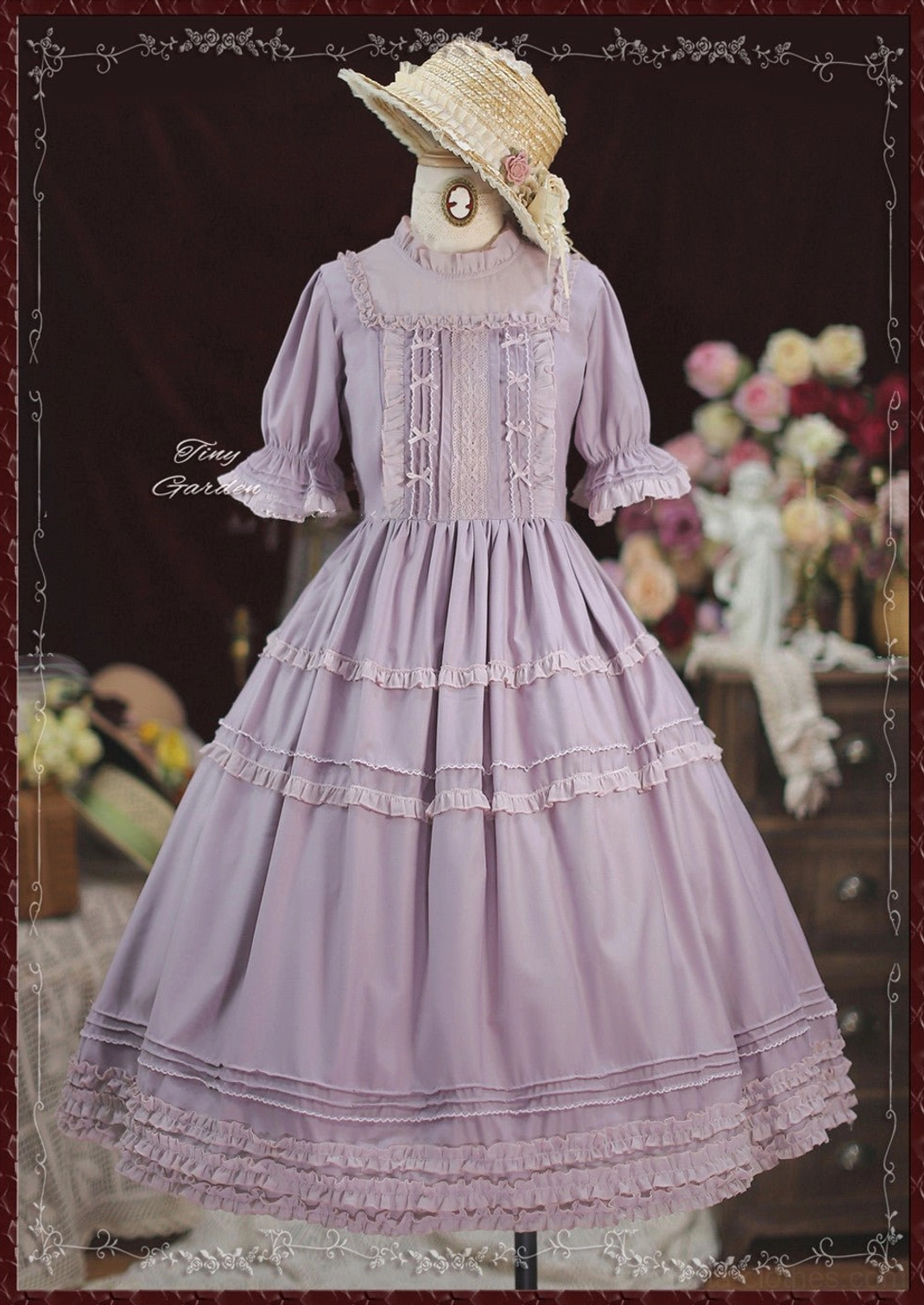 Light purple lavender lolita one-piece dress with pin tucks bodice ruffled tiered hemline shown on dress form with vintage floral backdrop