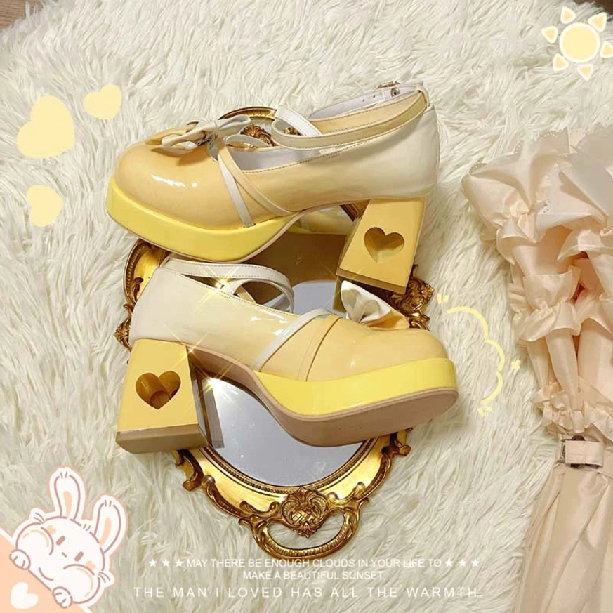 Light yellow gradient Sweet Lolita platform heels product photography displaying bow-adorned ankle strap, rounded toe, and innovative heart block heel design