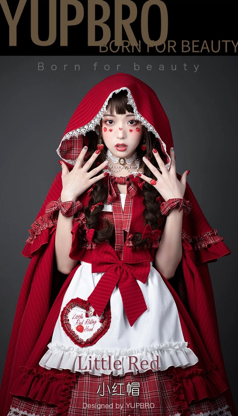 Little Red Riding Hood Lolita full costume set close-up front portrait view with model wearing hooded cape matching dress decorative apron wrist bows