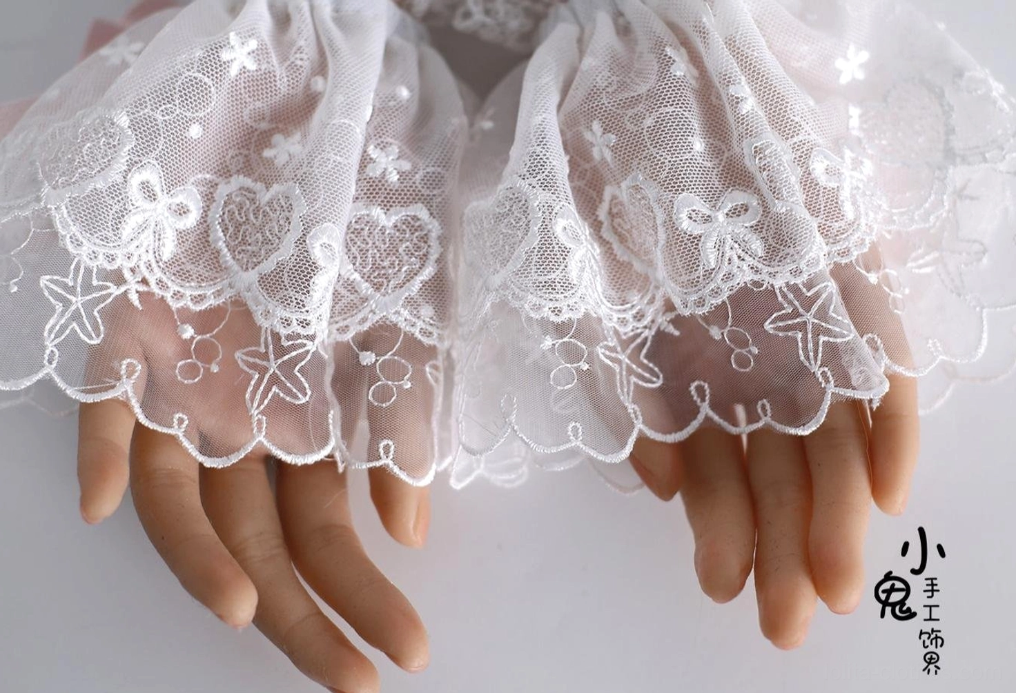 Lolita accessory quality showcase featuring secure clip fastening, double-layer lace construction, fluffy pom-pom accents, and refined satin ribbon details
