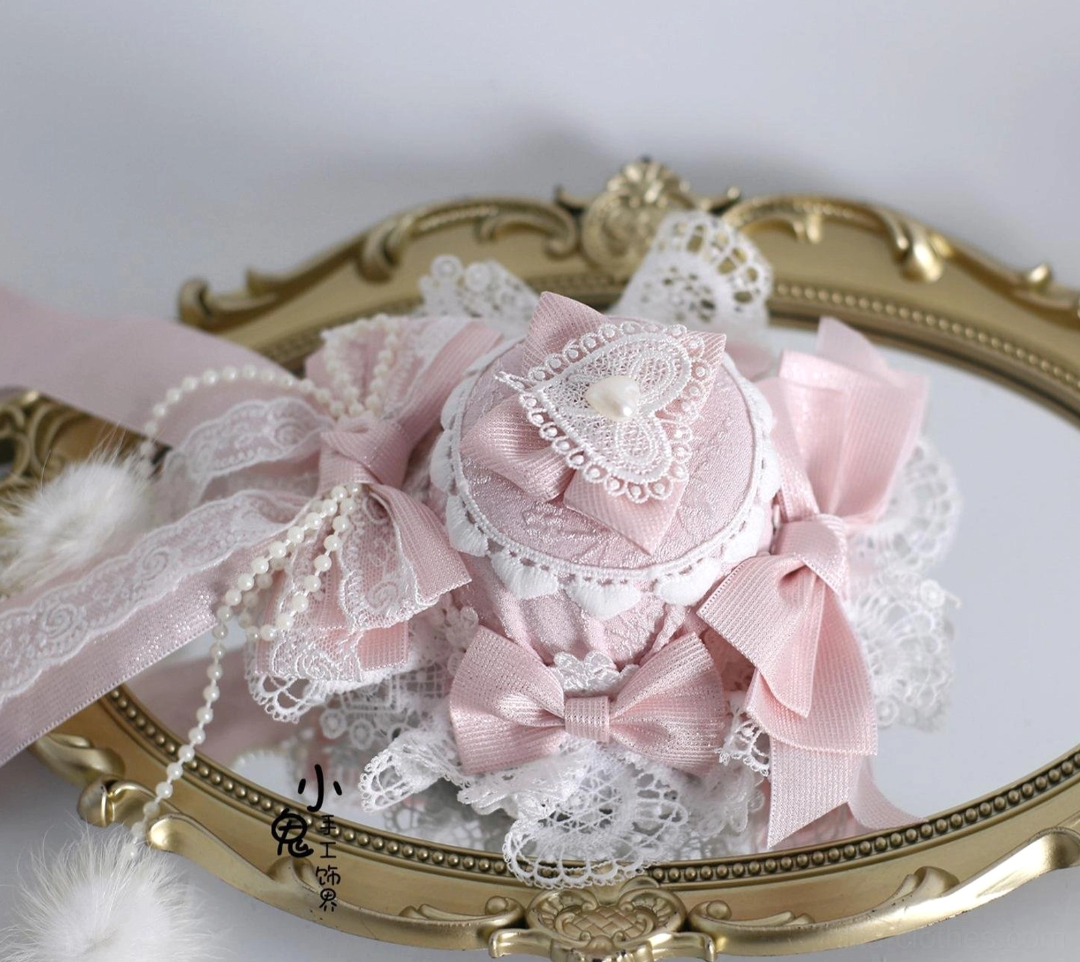 Lolita accessory styling guide showing multiple pieces including bonnet, choker, cuffs, and hairbows in coordinated white and pink color scheme