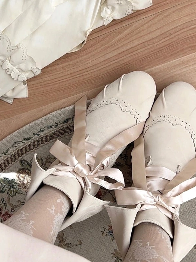 Lolita ankle boots cropped artistic detail shot emphasizing ribbon bow decoration ankle collar versatility and romantic vintage aesthetic elements