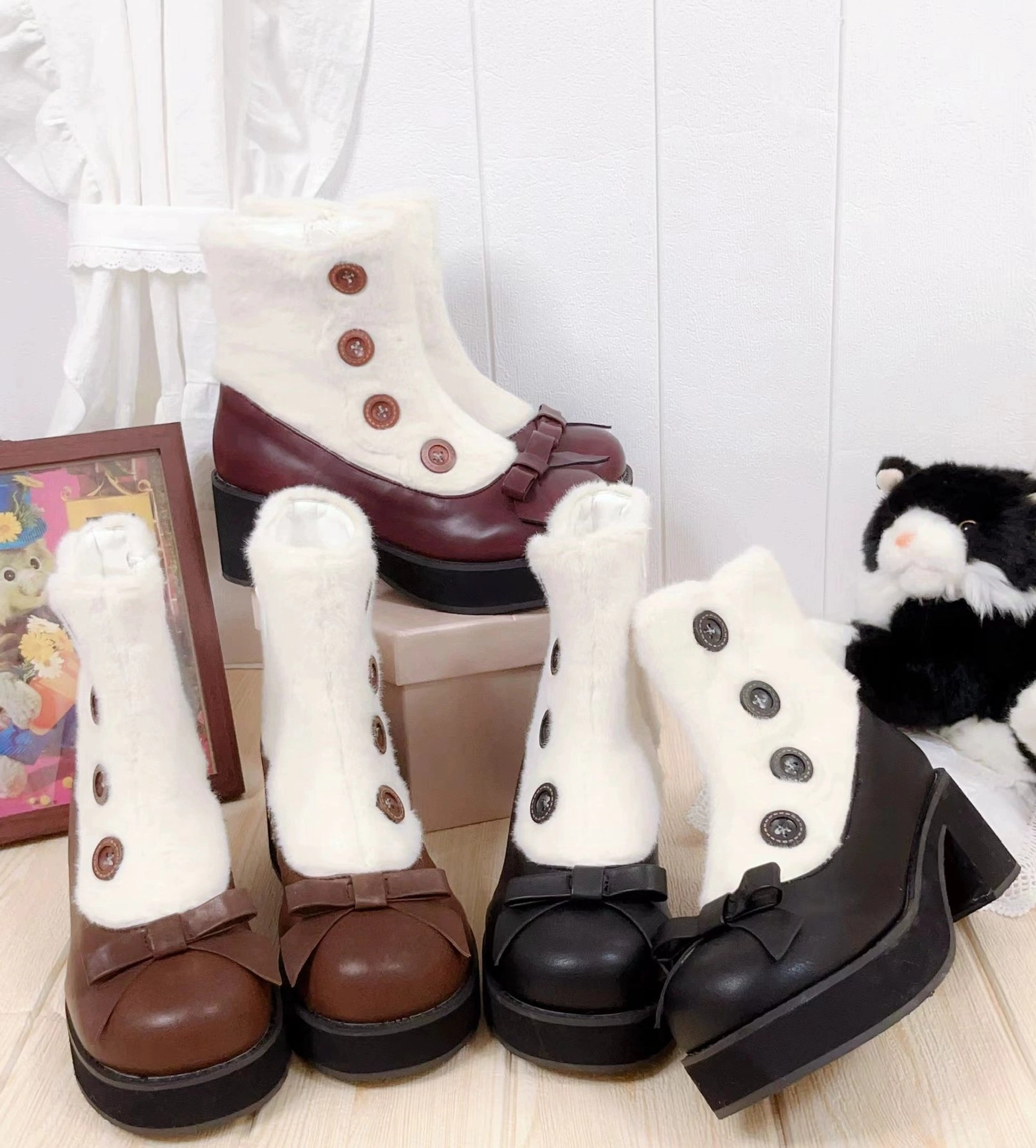 Lolita ankle boots with faux fur cuff decorative buttons bow ornament and block heel three color variants flat lay display