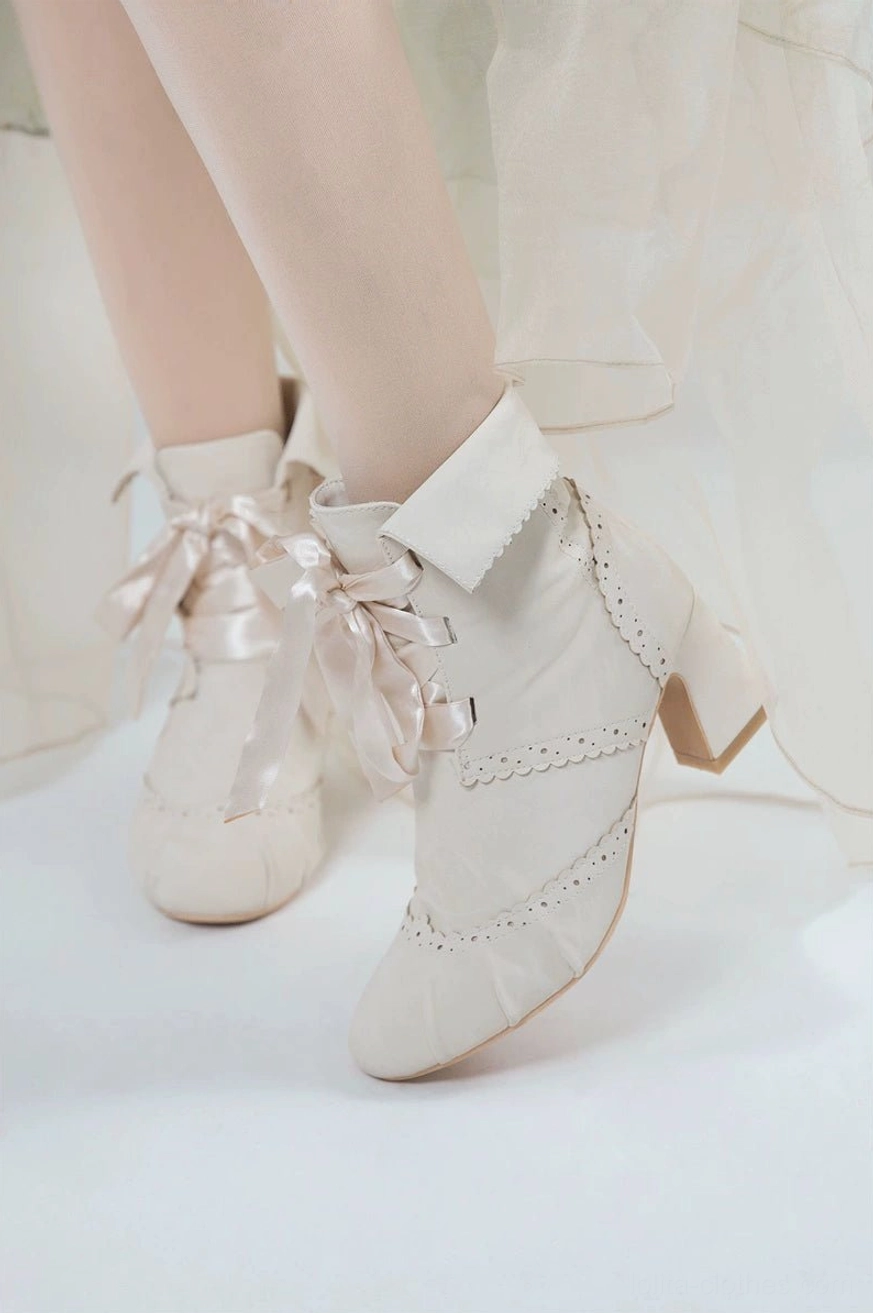 Lolita ankle boots heel and sole construction detail view showing block heel architecture non-slip rubber sole and premium materials quality