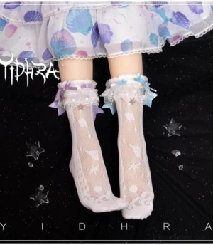 Lolita ankle socks with marine pattern mesh fabric and detachable ruffled lace cuffs featuring purple and blue satin bows with starfish pendants, styled overhead with coordinating shell-print skirt on starry dark background