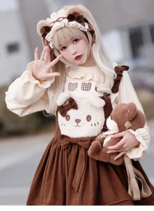 Blonde lolita girl wearing bear ear hairband with coordinated brown and beige dress holding teddy bear outdoor street style