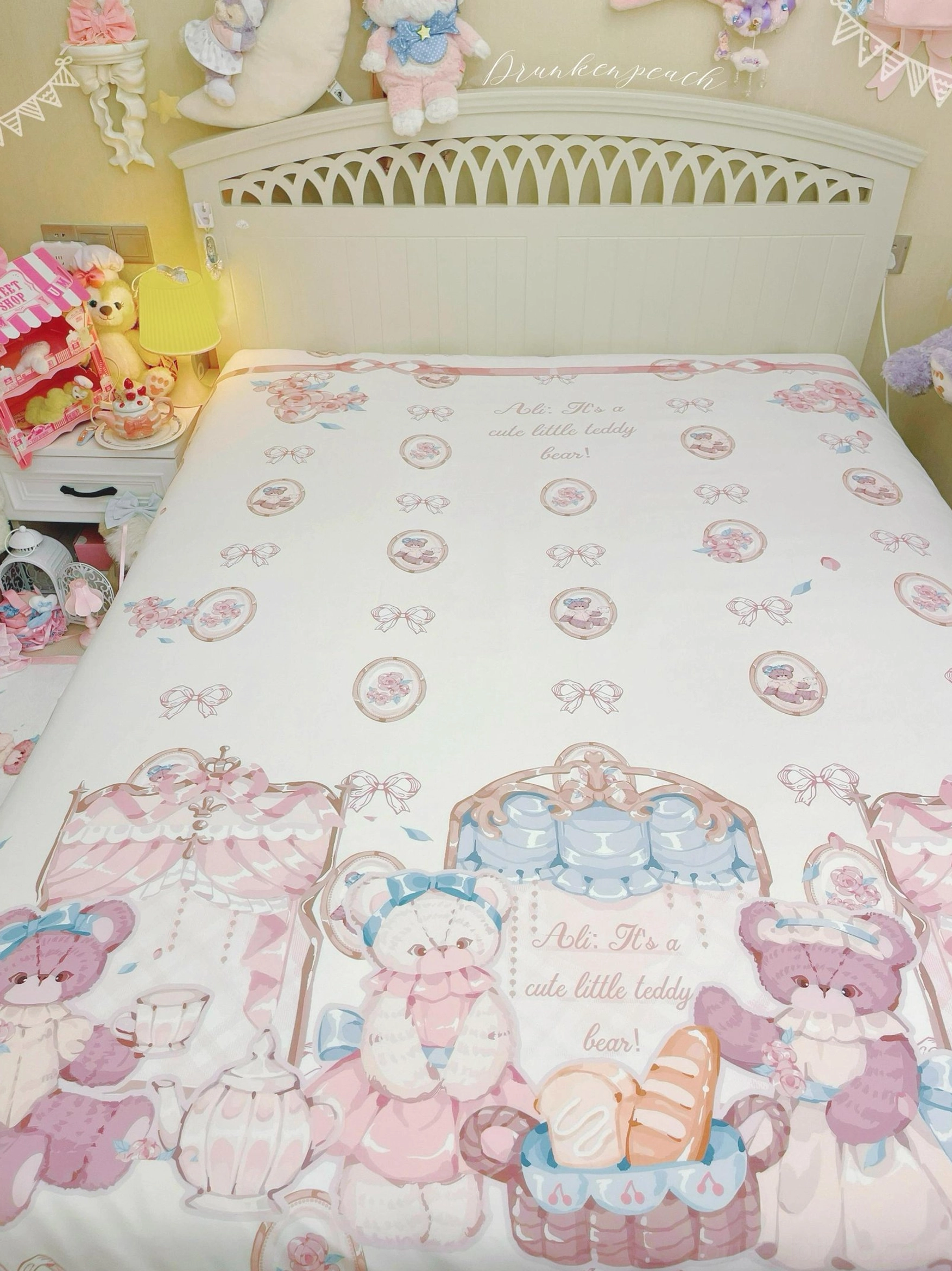 Single ruffled pillow sham and partial lolita bedding set showing detailed bear tea party print, subtle bow printed bed sheet, and ruffled edge construction in pastel bedroom setting
