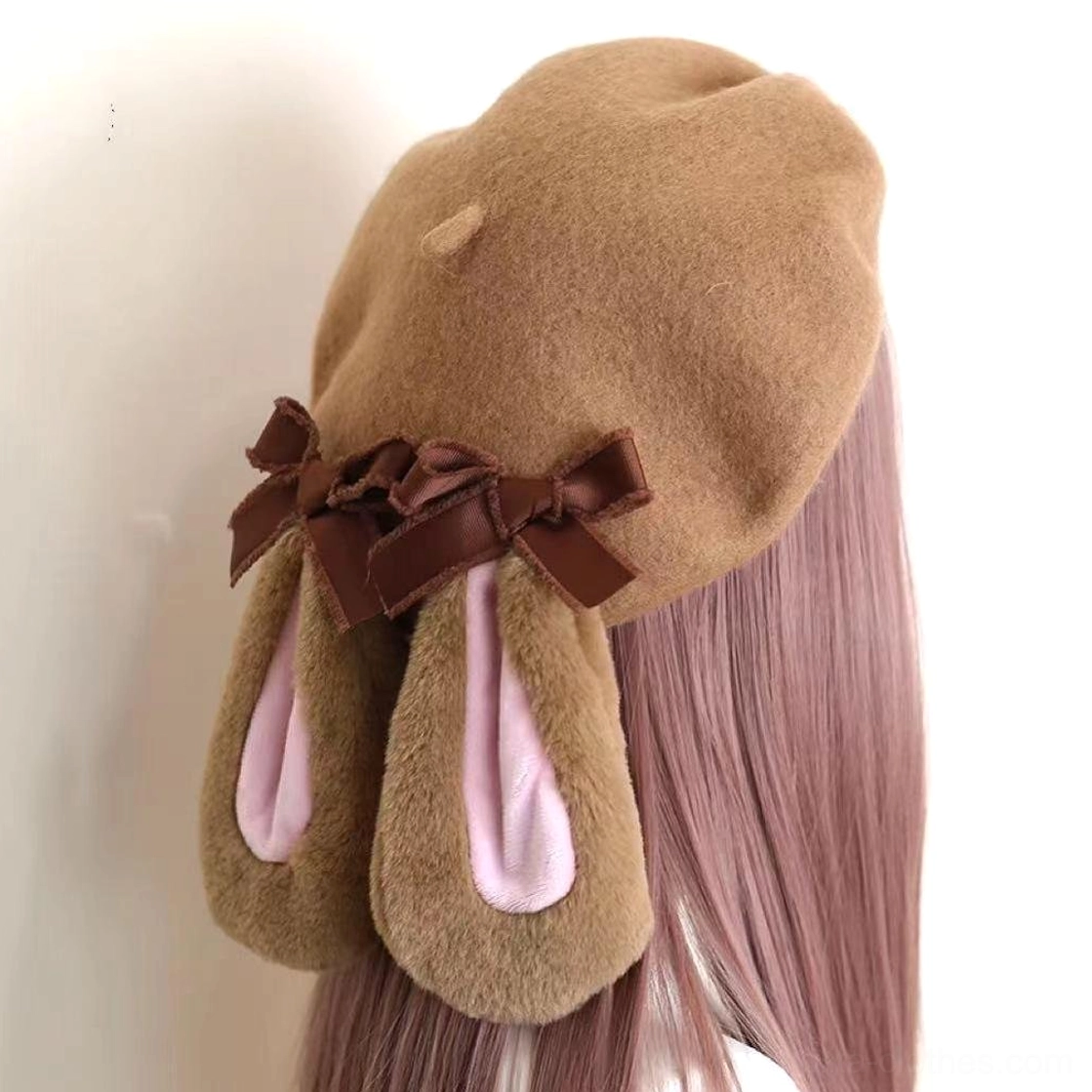Plush rabbit ear beret back three-quarter view showing dual ribbon bows and soft pink inner ear lining Lolita headpiece