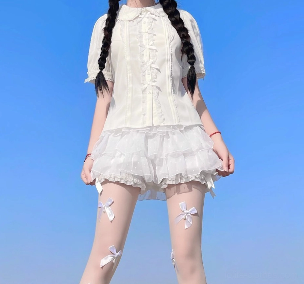 Detailed view of lolita bloomers construction showing elastic waistband, satin bows, and ruffled leg design elements