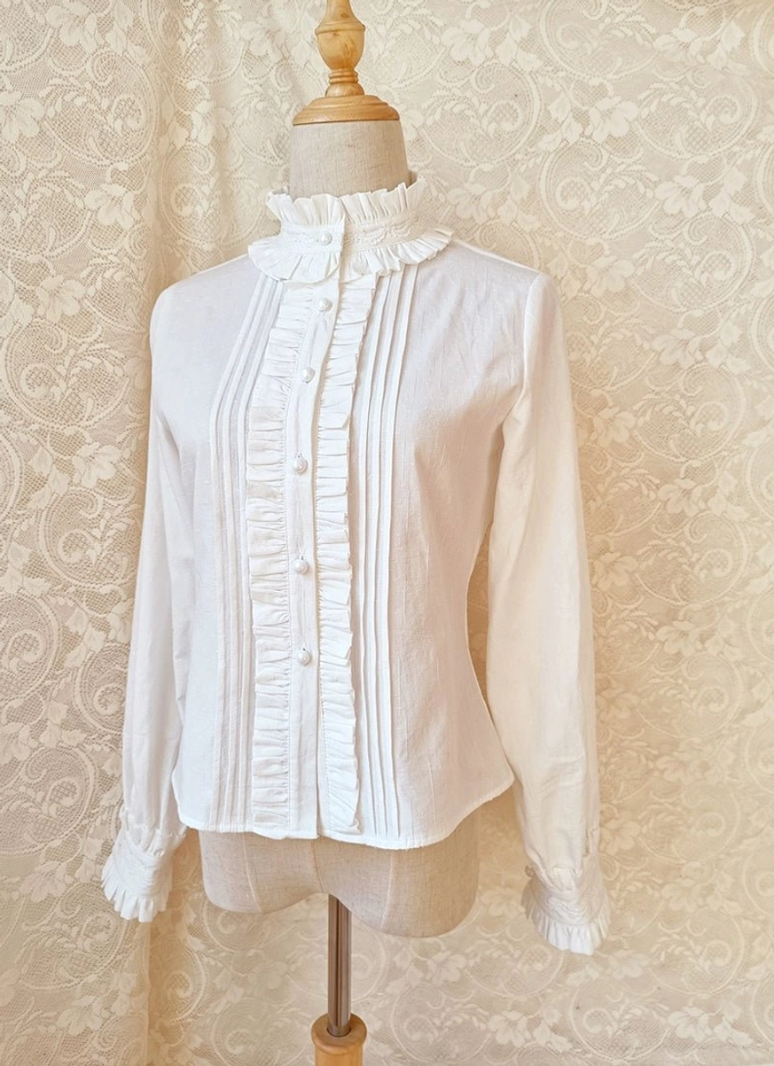 Back view of white lolita stand collar blouse with pleated ruffle front design and neat silhouette