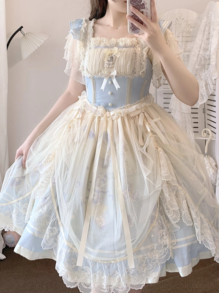 Lolita blouse back view showing tie-back design and three-tiered flutter sleeve construction