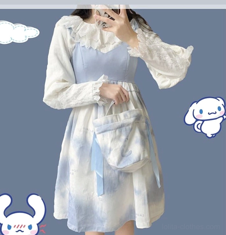 Full mirror selfie outfit coordination showing white lace collar lolita blouse with blue tie-dye skater dress and matching crossbody bag, modeled with sanrio cartoon sticker background