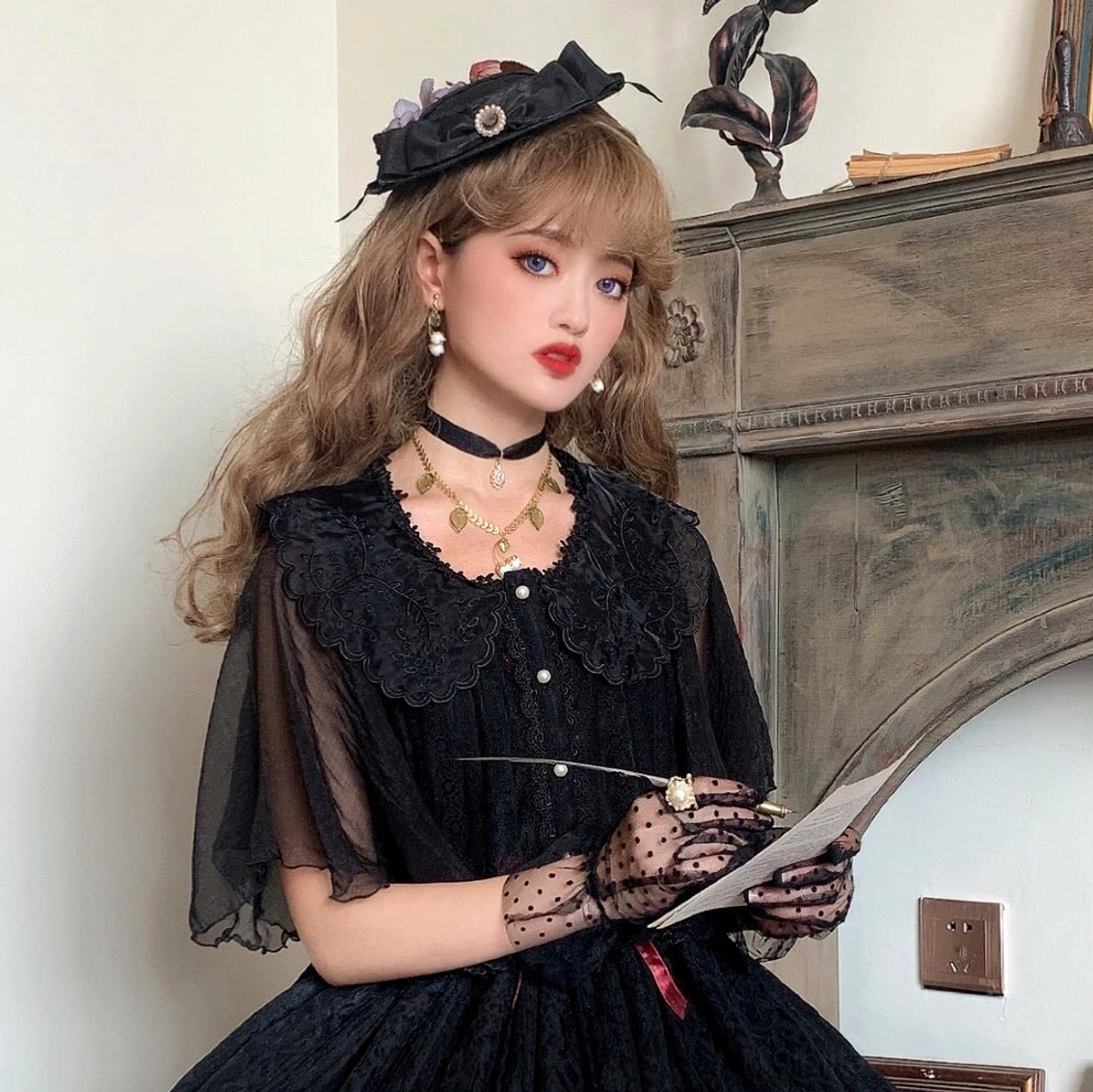 close-up detail of lolita blouse showing embroidered collar lace accents and pearl button fastening