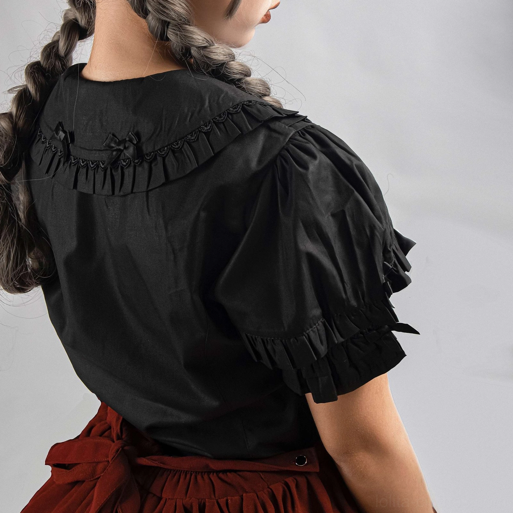 Lolita short sleeve blouse with intricate embroidered front symmetrical design and ruffled doll neckline aesthetic detail photography
