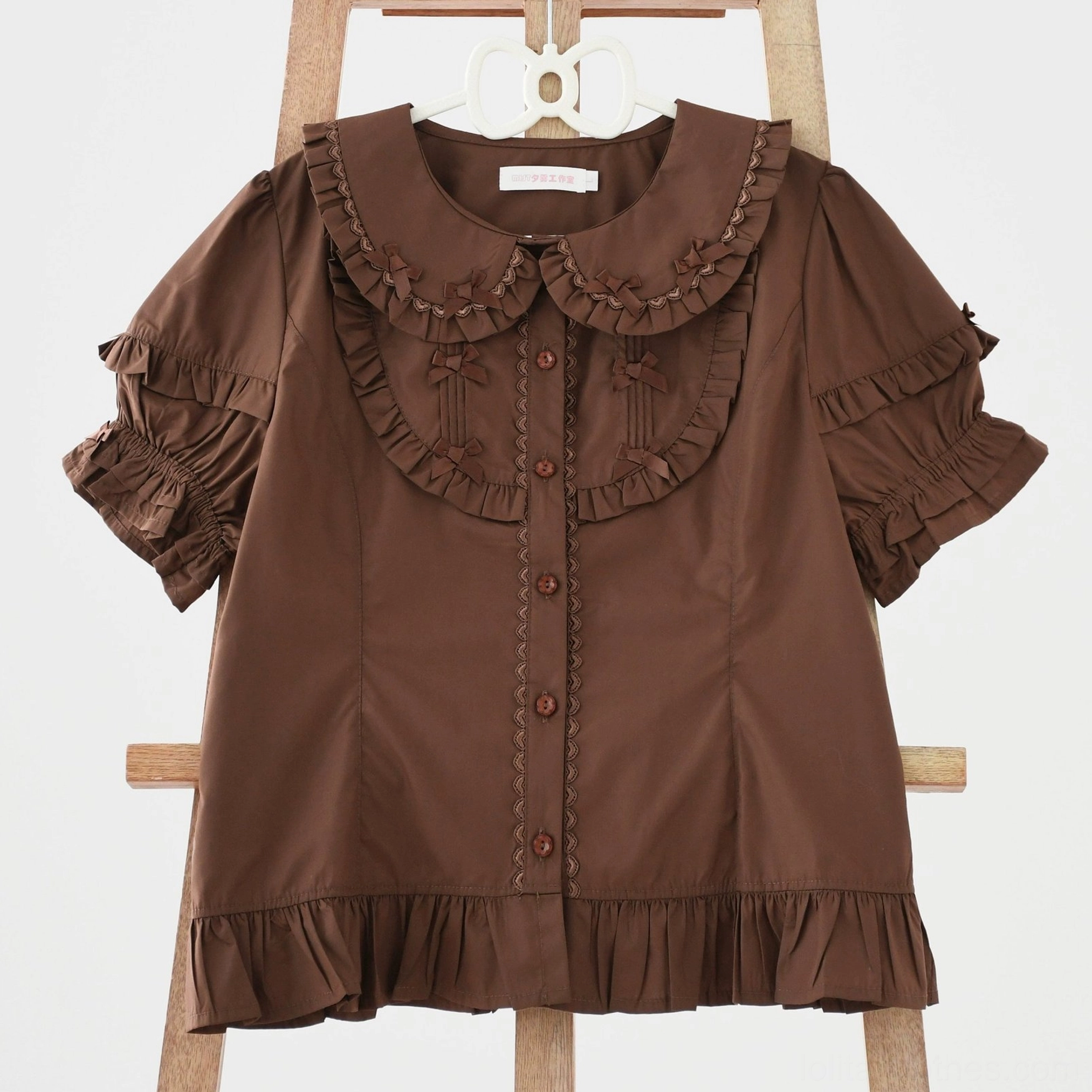 Lolita blouse fabric blend quality showing polyester cotton combination for structured drape and easy maintenance
