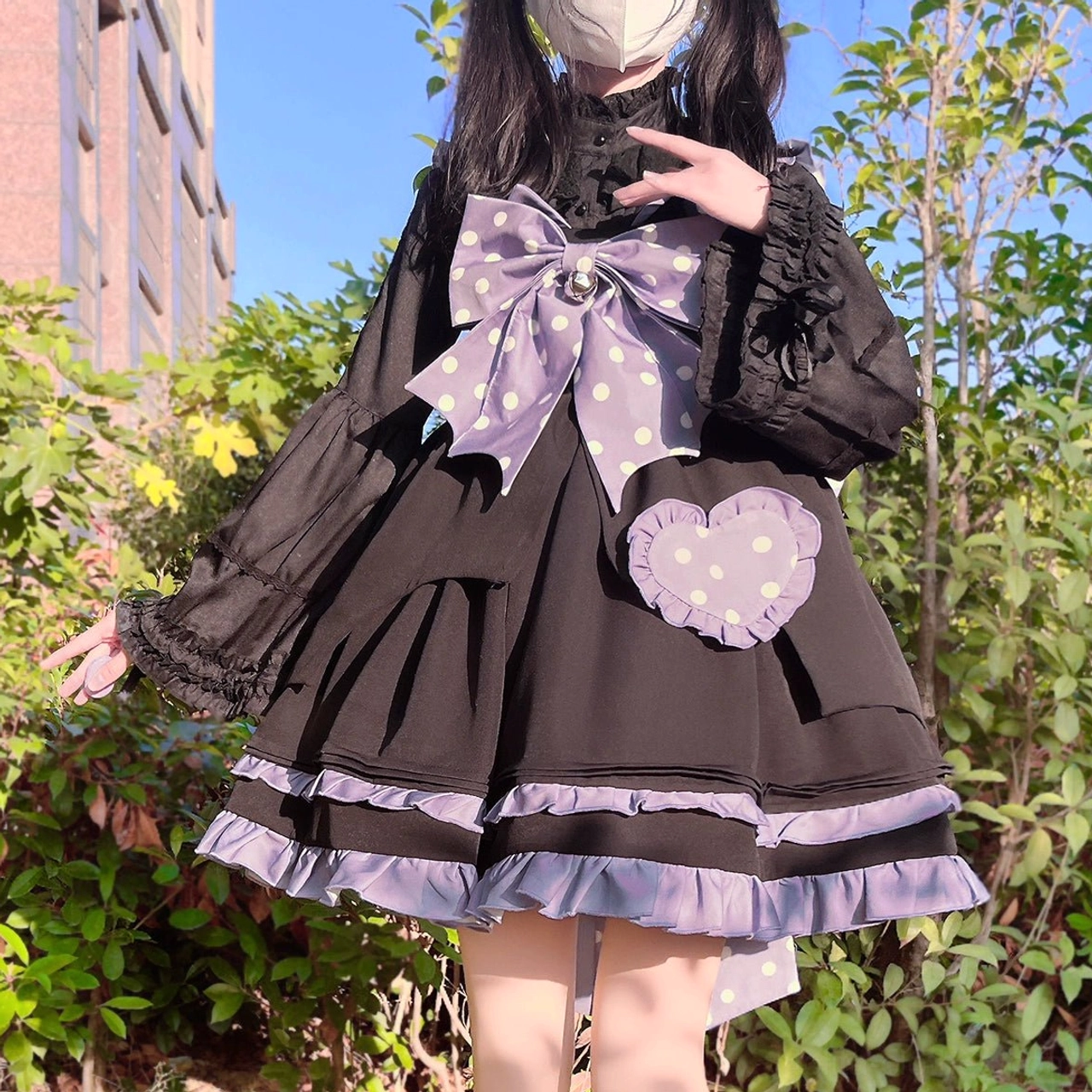 Milky white Lolita blouse pattern and texture close-up showing polyester fabric quality, weave structure, and durability of decorative elements and ruffles