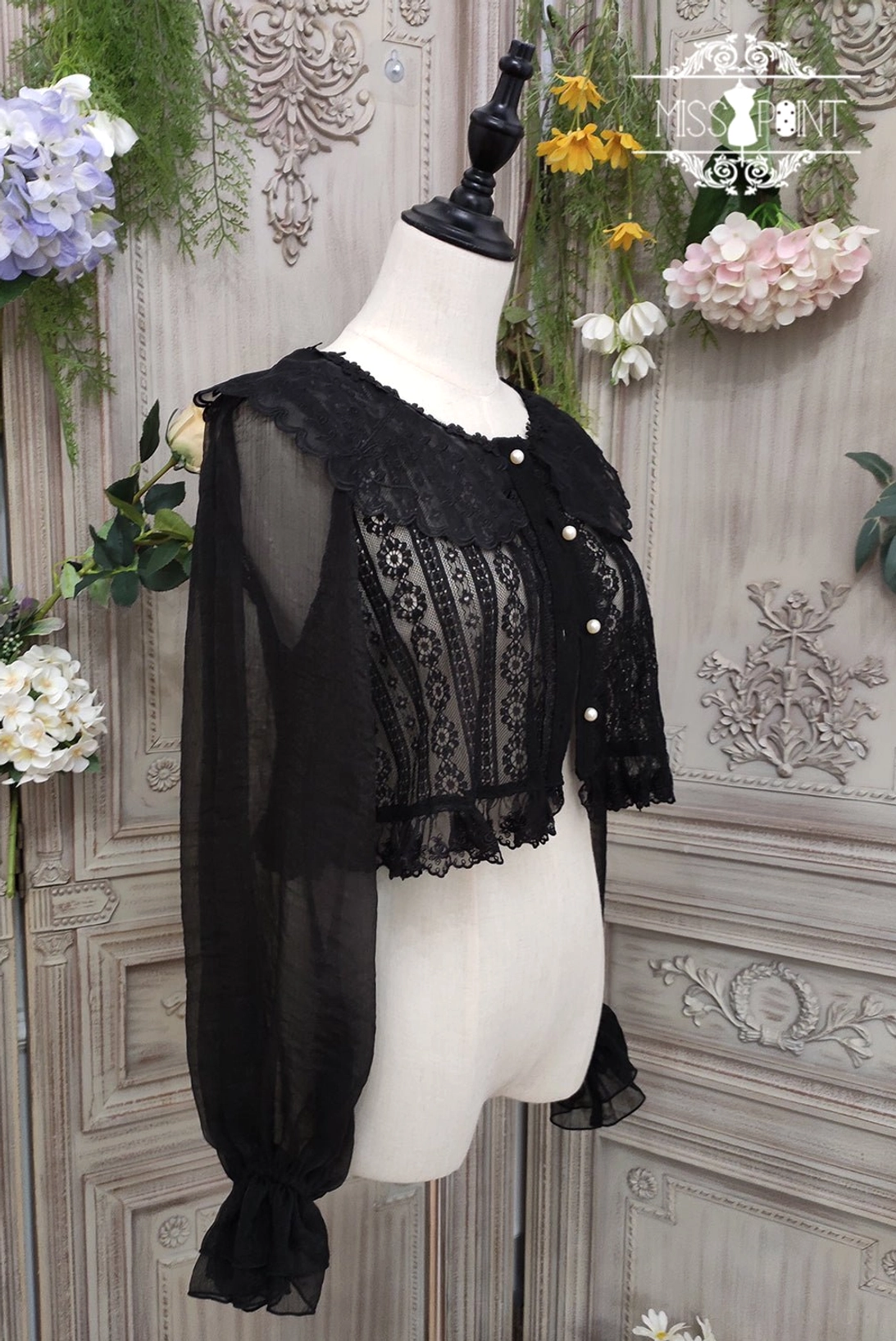 lolita blouse front view showing hollowed-out detail and floral lace pattern craftsmanship