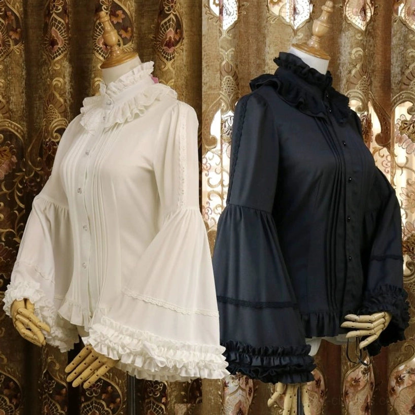 Matching pair of classic Lolita blouses in milky white and black displayed side by side on dress forms, featuring identical ruffled collars, pleated front plackets, and adjustable flared sleeves