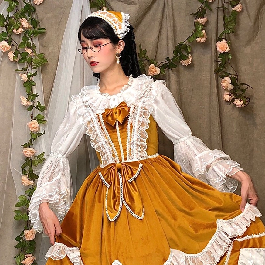 Close-up detail of lolita blouse neckline and upper torso showing pleated round collar and lace embellishment craftsmanship