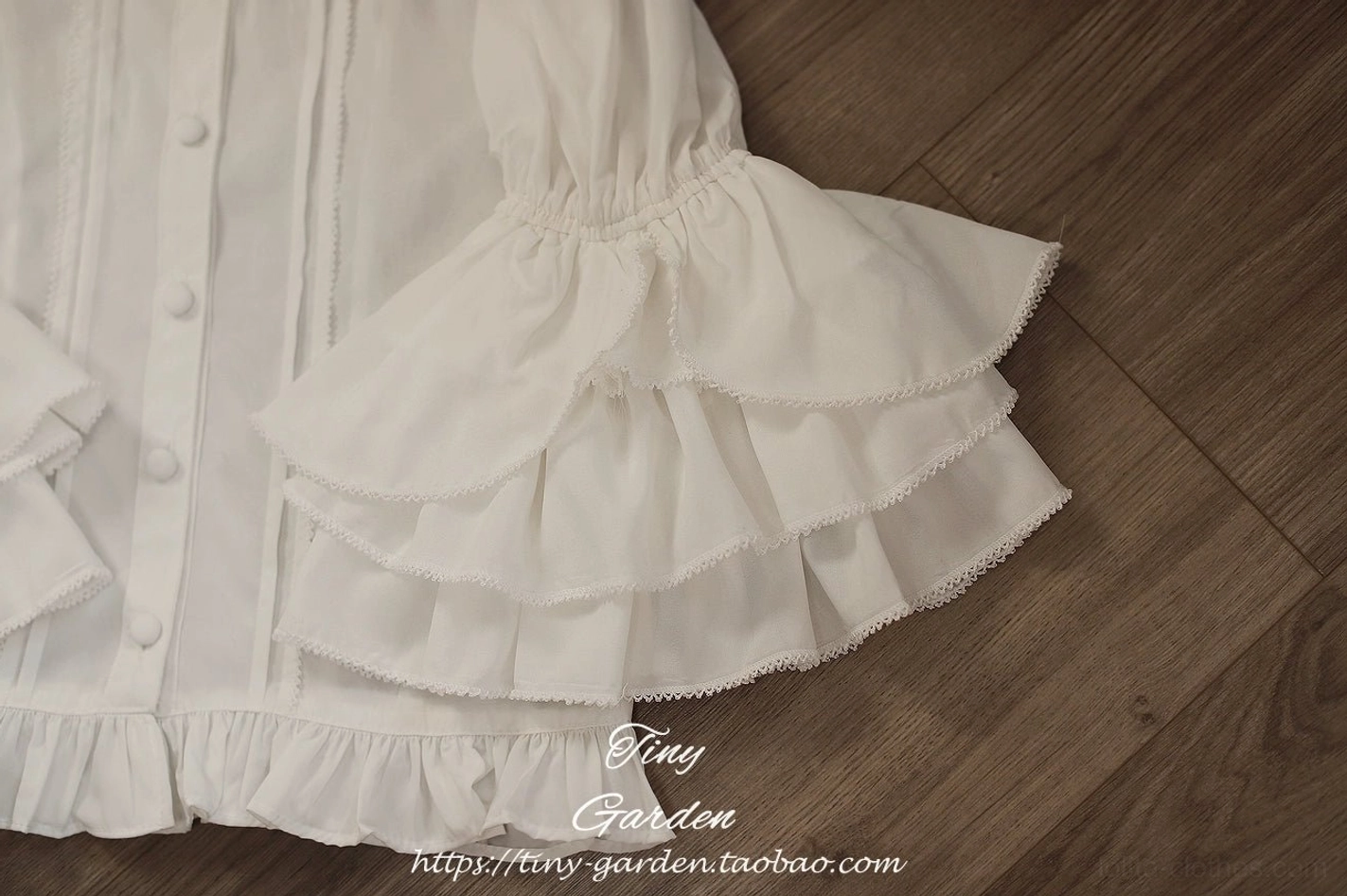 Ruffled lolita blouse sleeve detail showcase featuring layered princess bell sleeves and intricate ruffled hem, demonstrating Victorian-inspired aesthetic and elegant construction